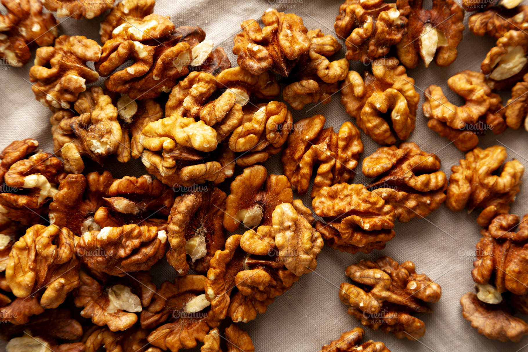 Raw Walnut Halfs, top view. Flat lay, overhead., a Food & Drink Photo by LiudmylaChuhunova