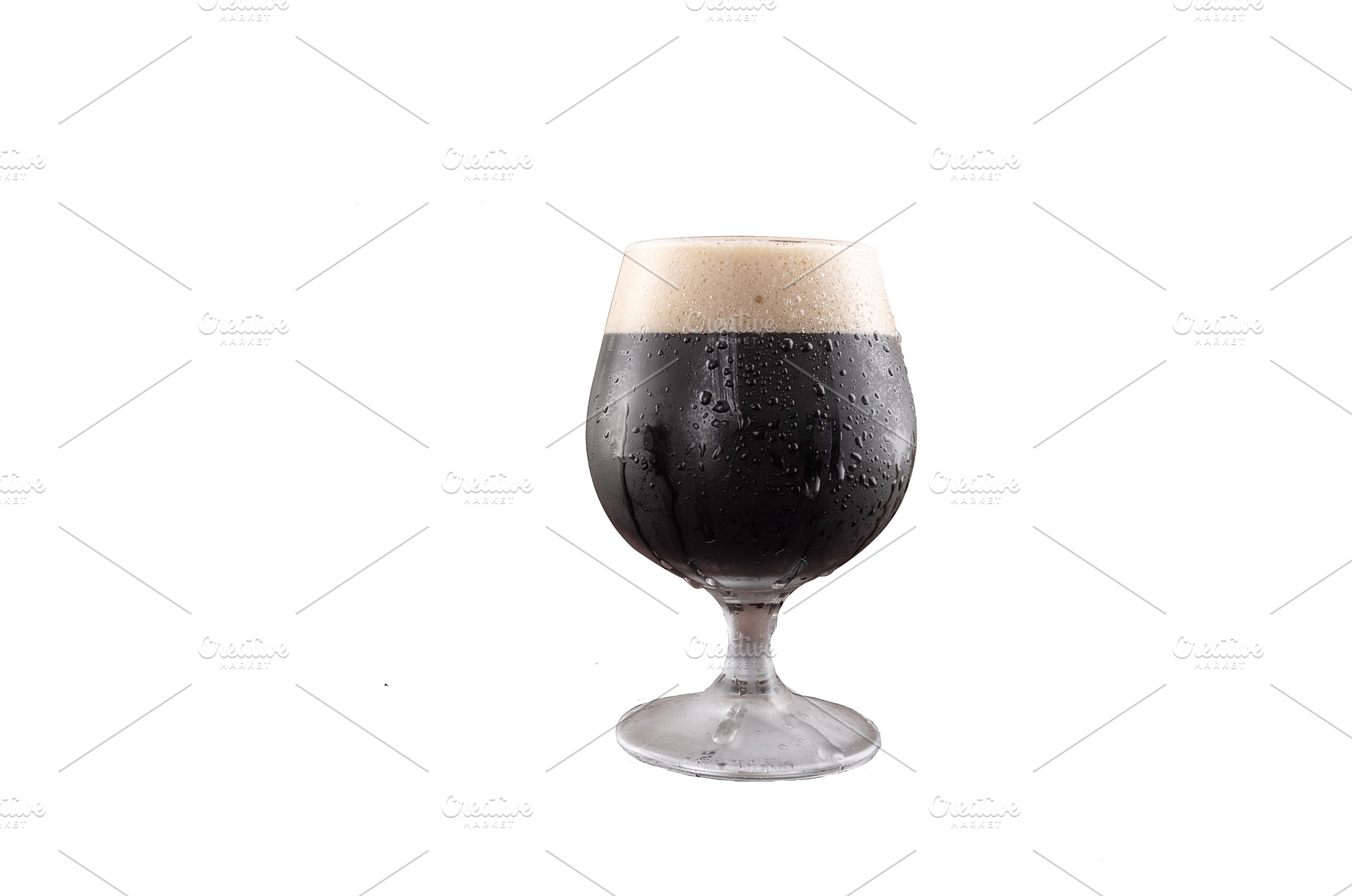 A glass of dark beer sits, a Food & Drink Photo by Stockphoto by vzwer