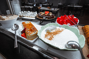 Dessert buffet with assorted sweets, a Food & Drink Photo by SkyNext