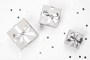 Silver gift boxes with ribbon bows, a Holiday Photo by Anna Efetova