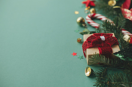 Stylish christmas border with festive decorations, gift, confett, a Holiday Photo by Sonjachni