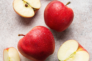 Ripe red apples whole and sliced fresh fruit, a Food & Drink Photo by Olena Rudo