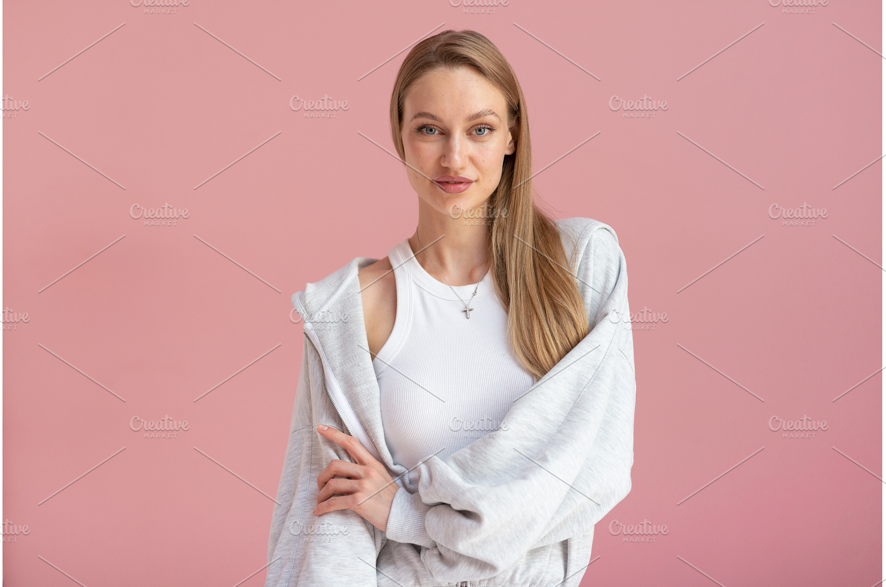 Young woman poses in gray loungewear, a Person Photo by undrey