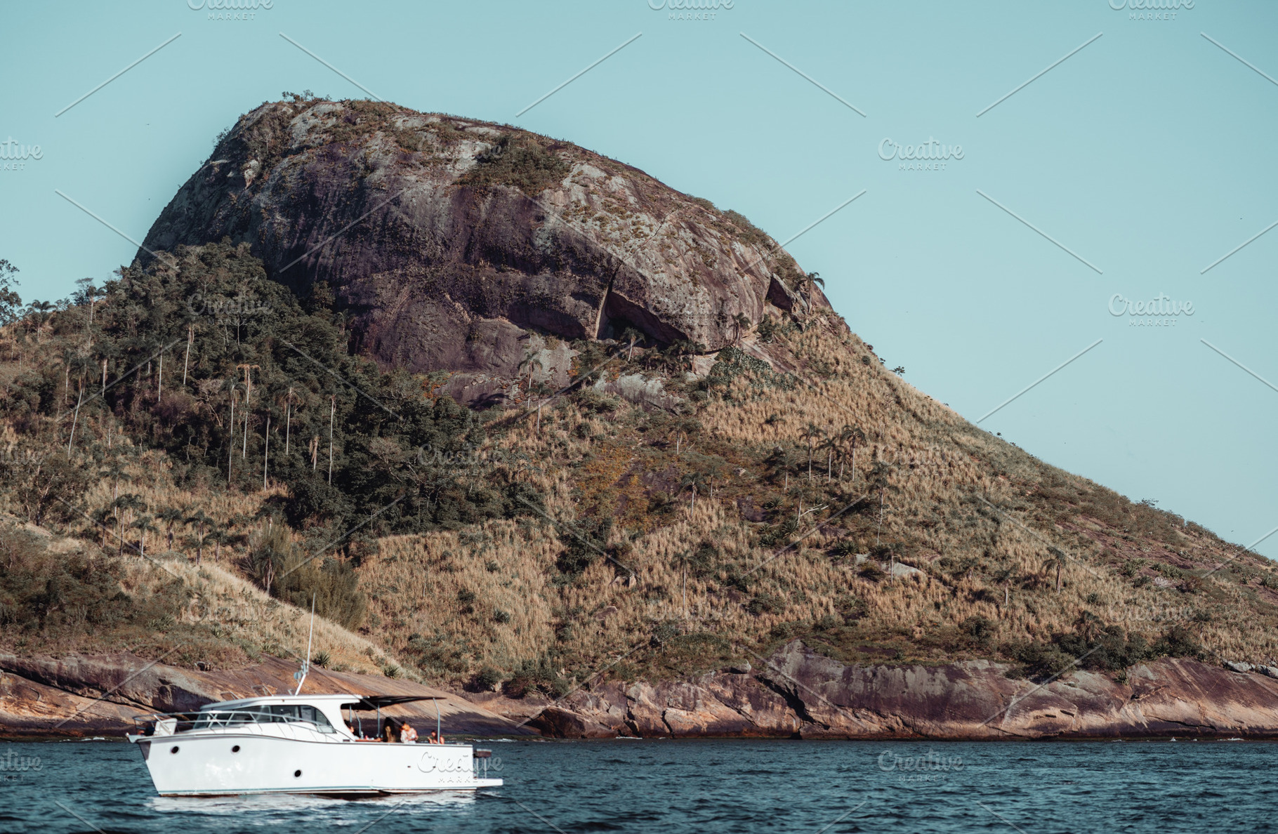 Yacht by rocky island, telephoto, a Sports & Recreation Photo by SkyNext