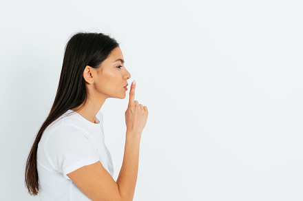 Side view young woman showing hush gesture holding index finger, a Person Photo by progressman