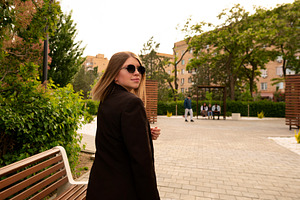 Stylish young woman walking outdoors, a Person Photo by Elena Vagengeim