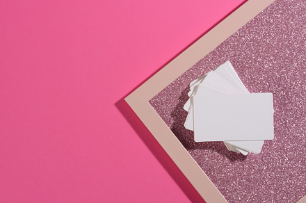 blank rectangular business card lies on a modern pink background, a Business Photo by ndanko