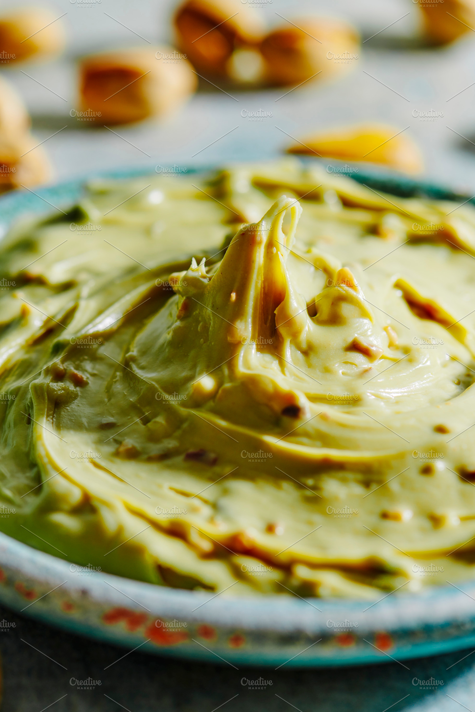 a close-up of pistachio cream in a bowl, a Photo by Nito