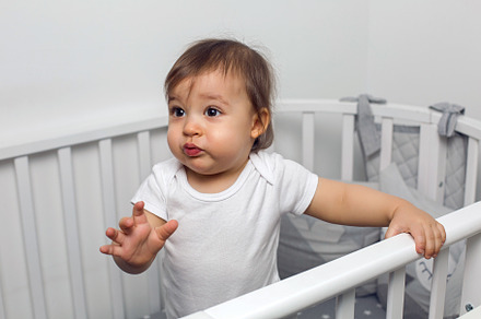 One year old child in white clothes containing baby, child, and bed, a Person Photo by SaulichPhoto