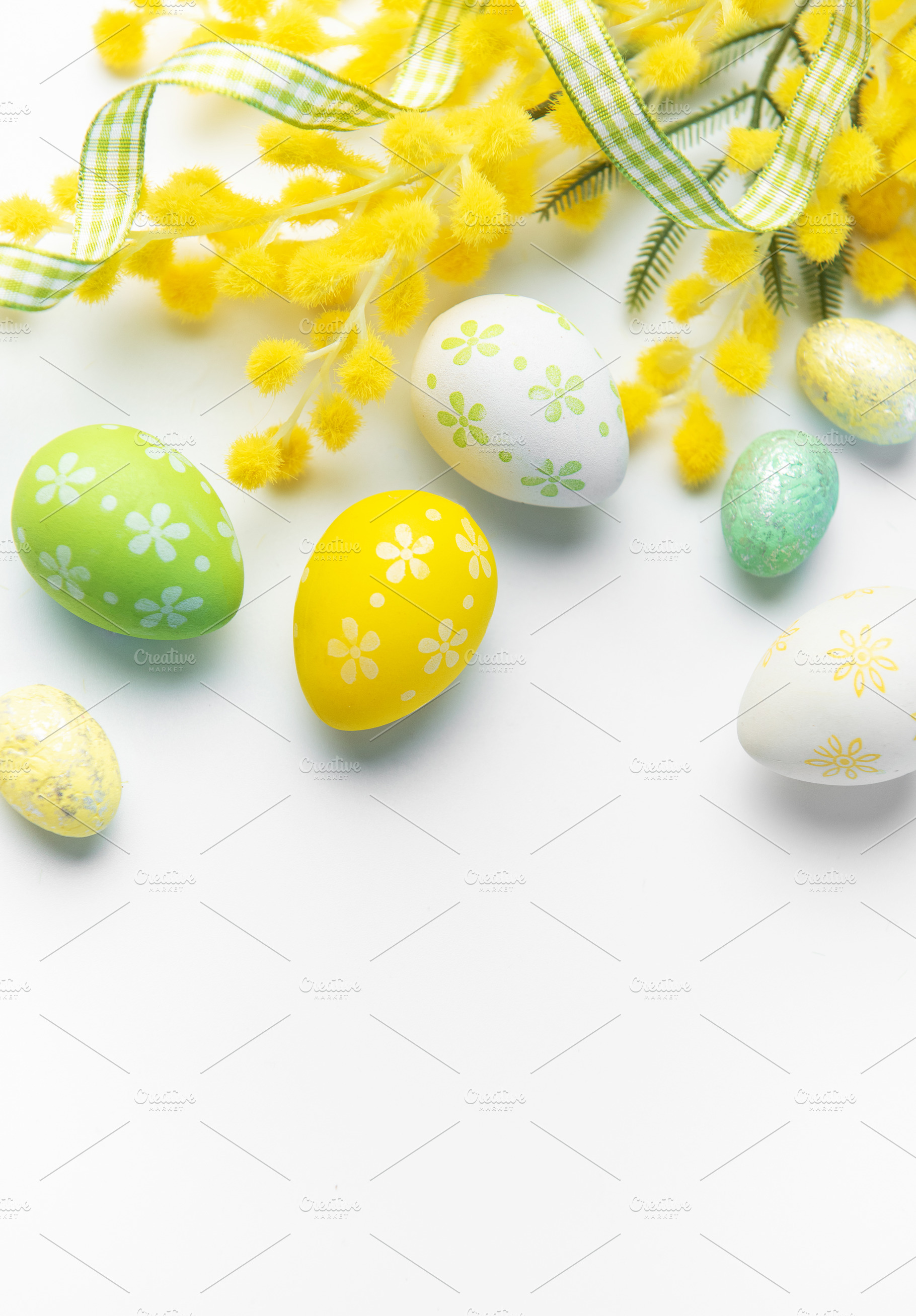 Easter eggs and mimosa creating spring holiday background, a Holiday Photo by Olena Rudo