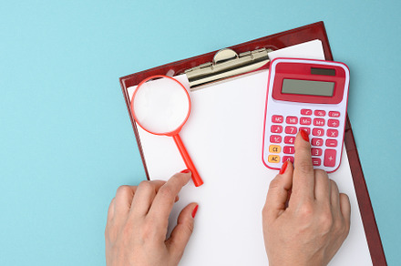 female hand presses the keys of a plastic pink calculator on a b, a Business Photo by ndanko