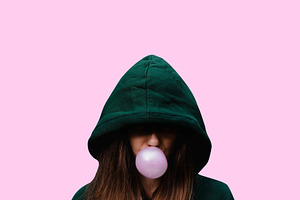 girl inflates chewing gum. bubble of