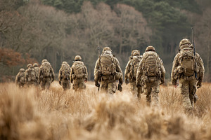 Soldiers walking through field milit, a Photo by Pixeness Studio