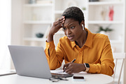 Angry business lady making report, sitting in front of laptop, a Photo by Prostock-Studio (Thumbnail 1 of 2)