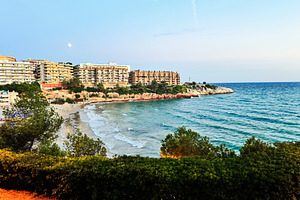 Coastal skyline and beach view in Tarragona, Catalunya, Spain under clear sky, a Photo by AS photostudio