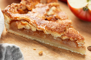 Apple pie slice on wooden board with apples, a Food & Drink Photo by Olena Rudo