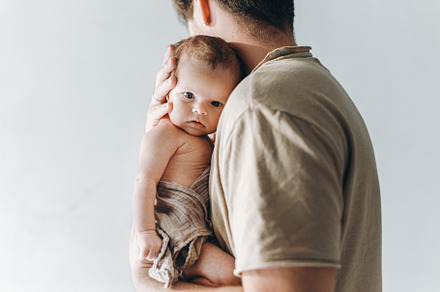 Happy Fathers day!  Stylish father hugging cute little baby son