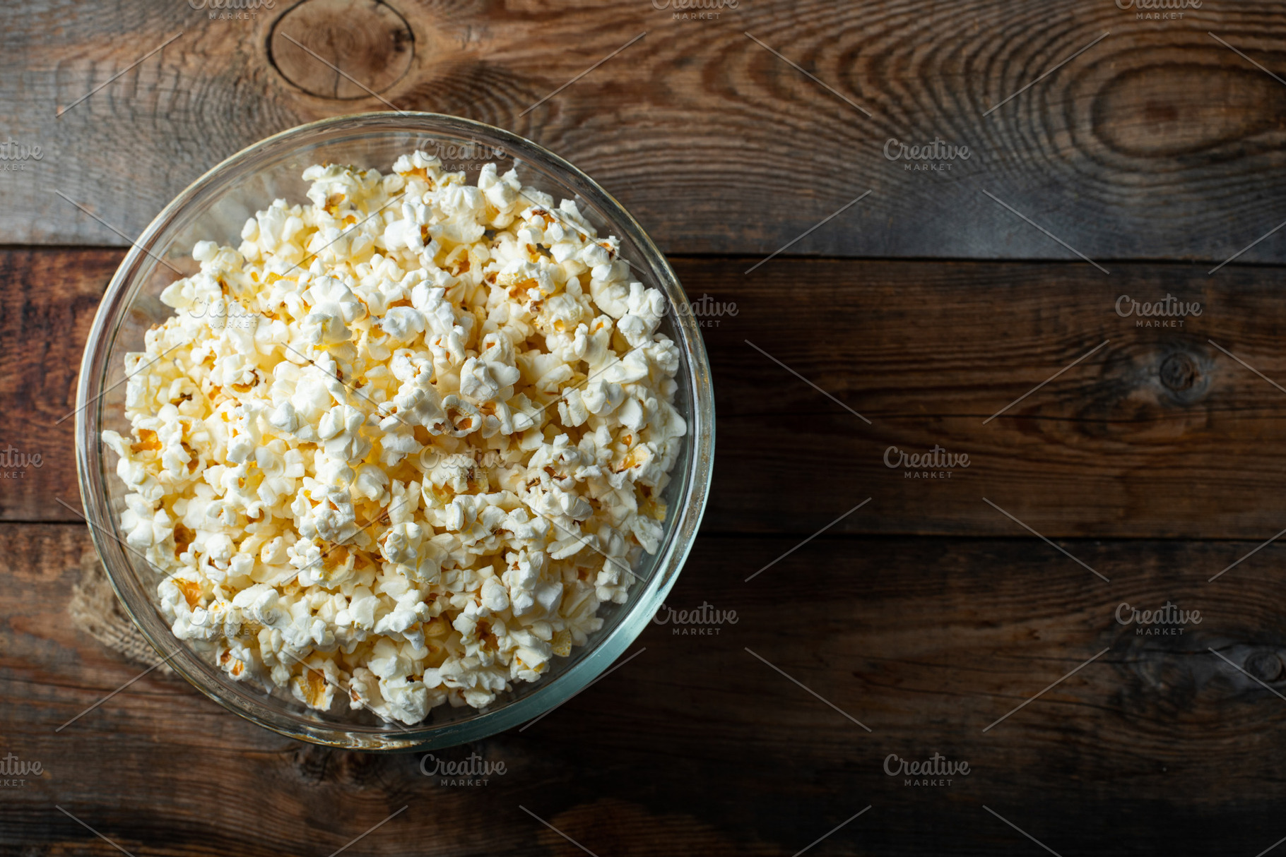 Pop corn on wood color background.Food and snack concepts ideas.Minimal style t, a Food & Drink Photo by Budarinphoto
