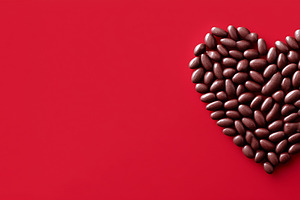 Heart shape made of beans on a red, a Holiday Photo by MistyDay