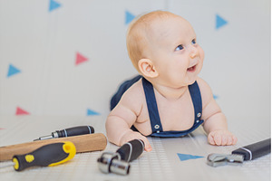 Adorable baby in a mechanic costume, a Person Photo by Elizaveta Galitskaya