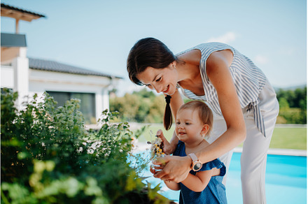 Young family taking care of plants