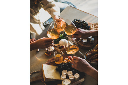 Hands of people clinking glasses, a Food & Drink Photo by Foxys
