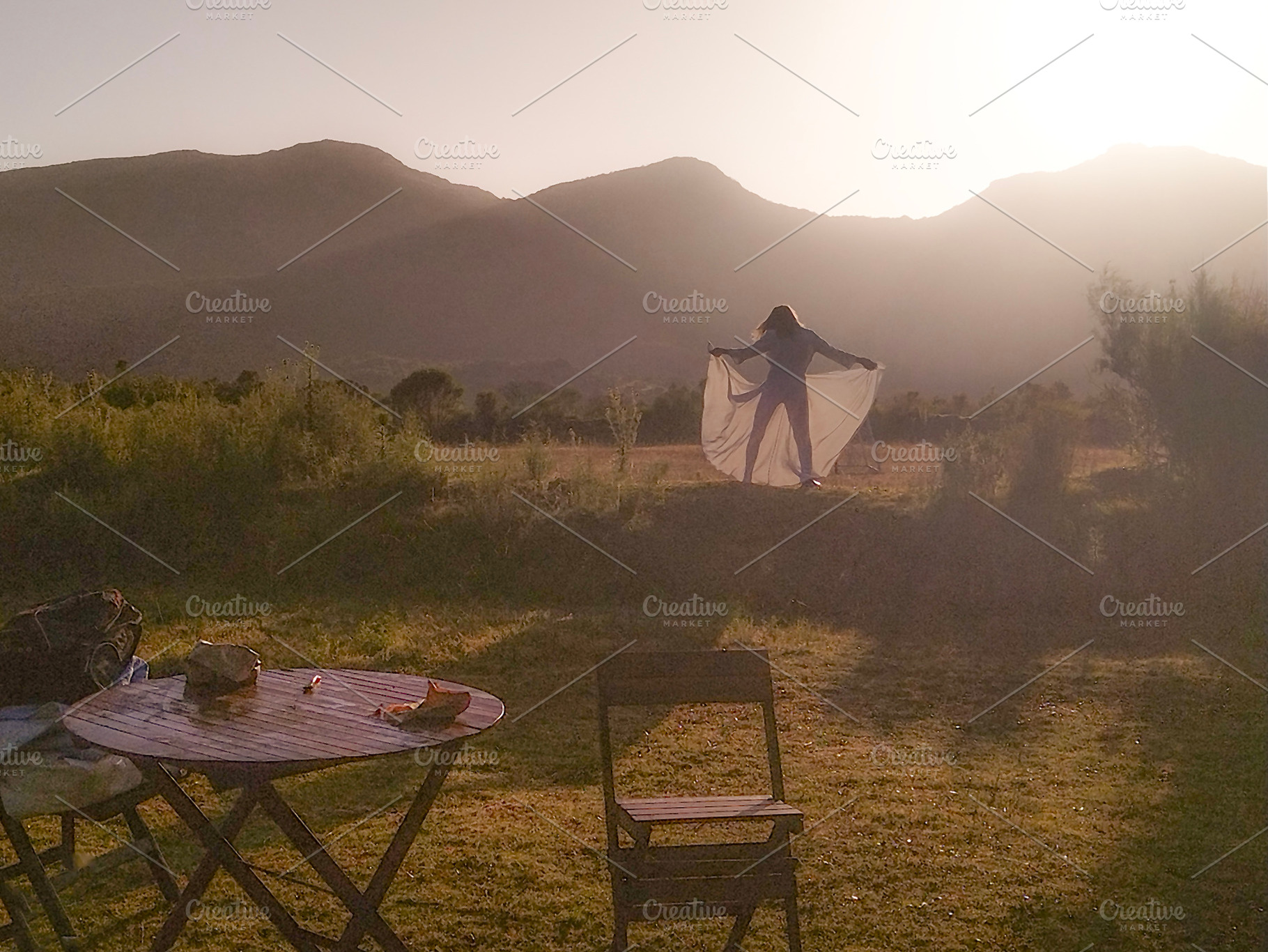 Woman in nature at sunrise expressing freedom, a Person Photo by DanFLCreativo