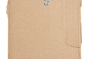 A torn piece of brown cardboard with a blue and white paper clip, a Background Photo by ndanko