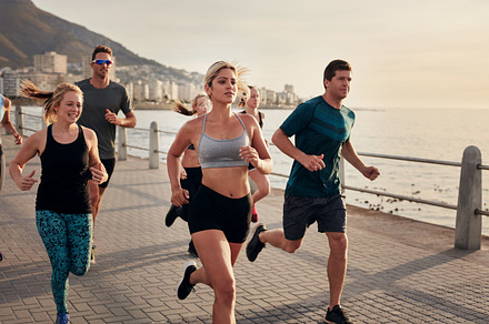 Group of young people running containing active, athletic, and carefree, a Sports & Recreation Photo by Jacob Lund