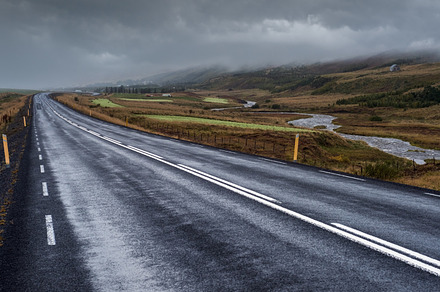 Highway road and mountain view during auto trip in Iceland. Spec, a Nature Photo by YuriyB