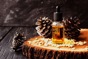 Jar of oil pine nuts selective focus space for text containing pine, oil, and