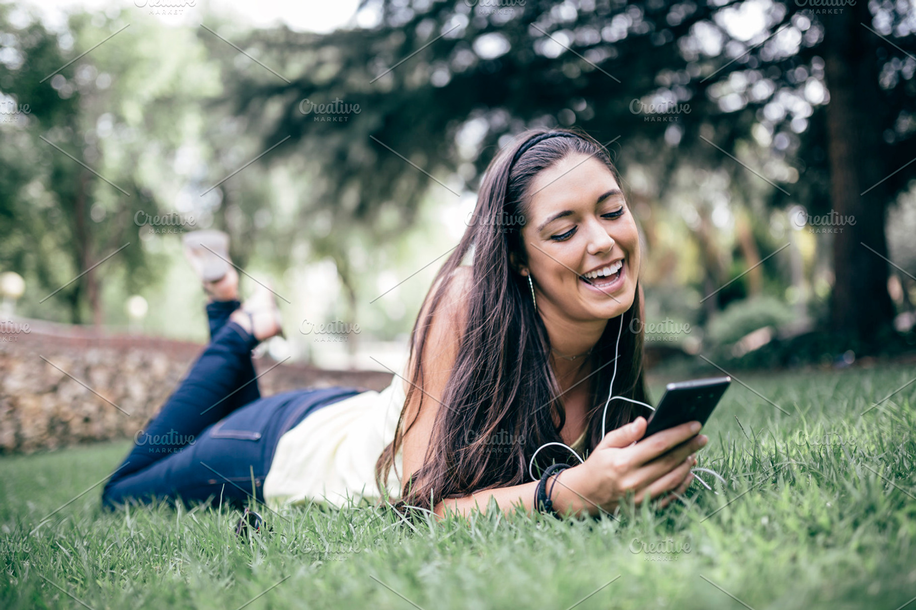 Lying on the grass stock photo containing people and hispanic appearance, a Person Photo by fotopitu