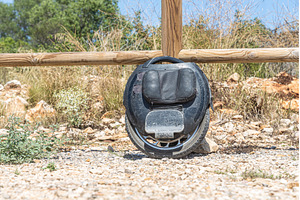 Electric unicycle leaning against