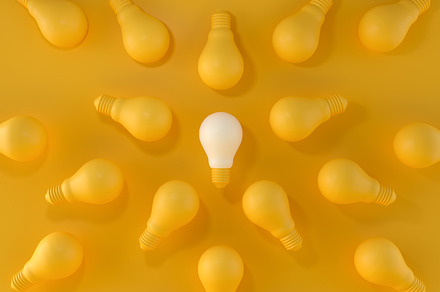 Light Bulb Standing Out From Crowd., a Business Photo by Zama Studio