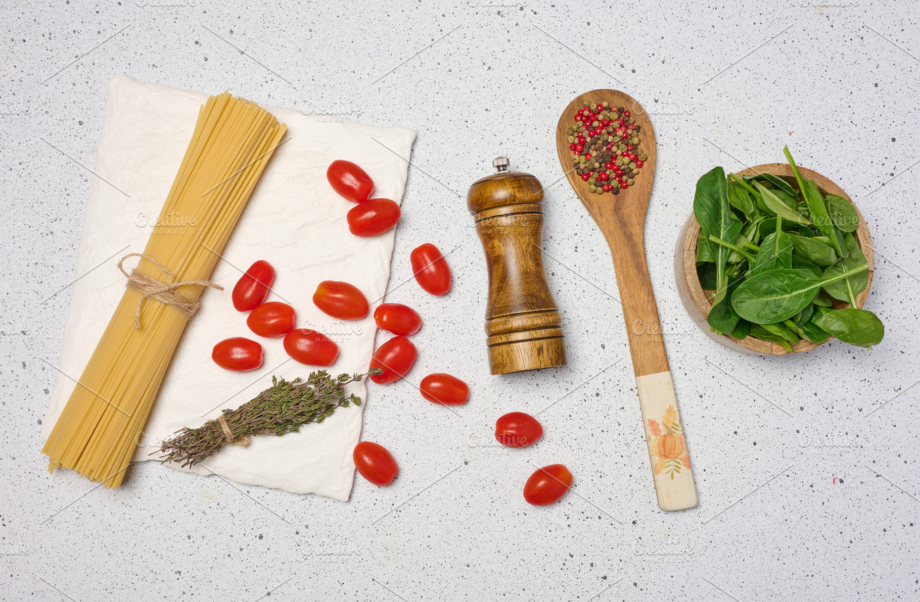 Wooden bowl with spinach, cherry tomatoes on a wooden plate, spo, a Food & Drink Photo by ndanko