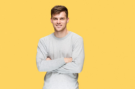 The young man smiling and looking at camera stock photo containing adult and, a Person Photo by Volodymyr Melnyk