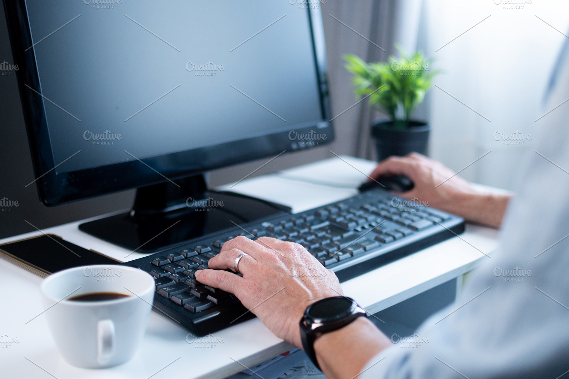 Close up of man typing on keyboard while working from home, a Person Photo by etorres69