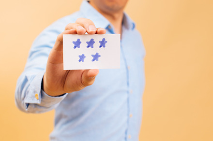 Businessman showing five yellow star stock photo containing customer and, a Person Photo by Twinster Photo