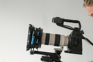 Videographer work studio cameraman man looks lens, a Person Photo by Photo Drive Studio