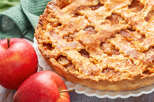 Freshly baked apple pie surrounded by ripe red apples and green, a Food & Drink Photo by Olena Rudo