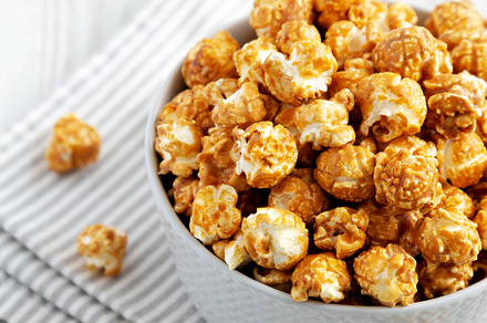 Homemade Caramel Popcorn in a gray Bowl, side view., a Food & Drink Photo by LiudmylaChuhunova