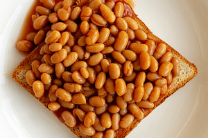 Homemade English Beans on Toast, top view. Close-up., a Food & Drink Photo by LiudmylaChuhunova