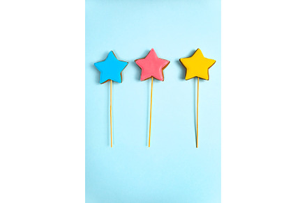Colorful cookies on sticks on a blue, a Holiday Photo by darksoul72