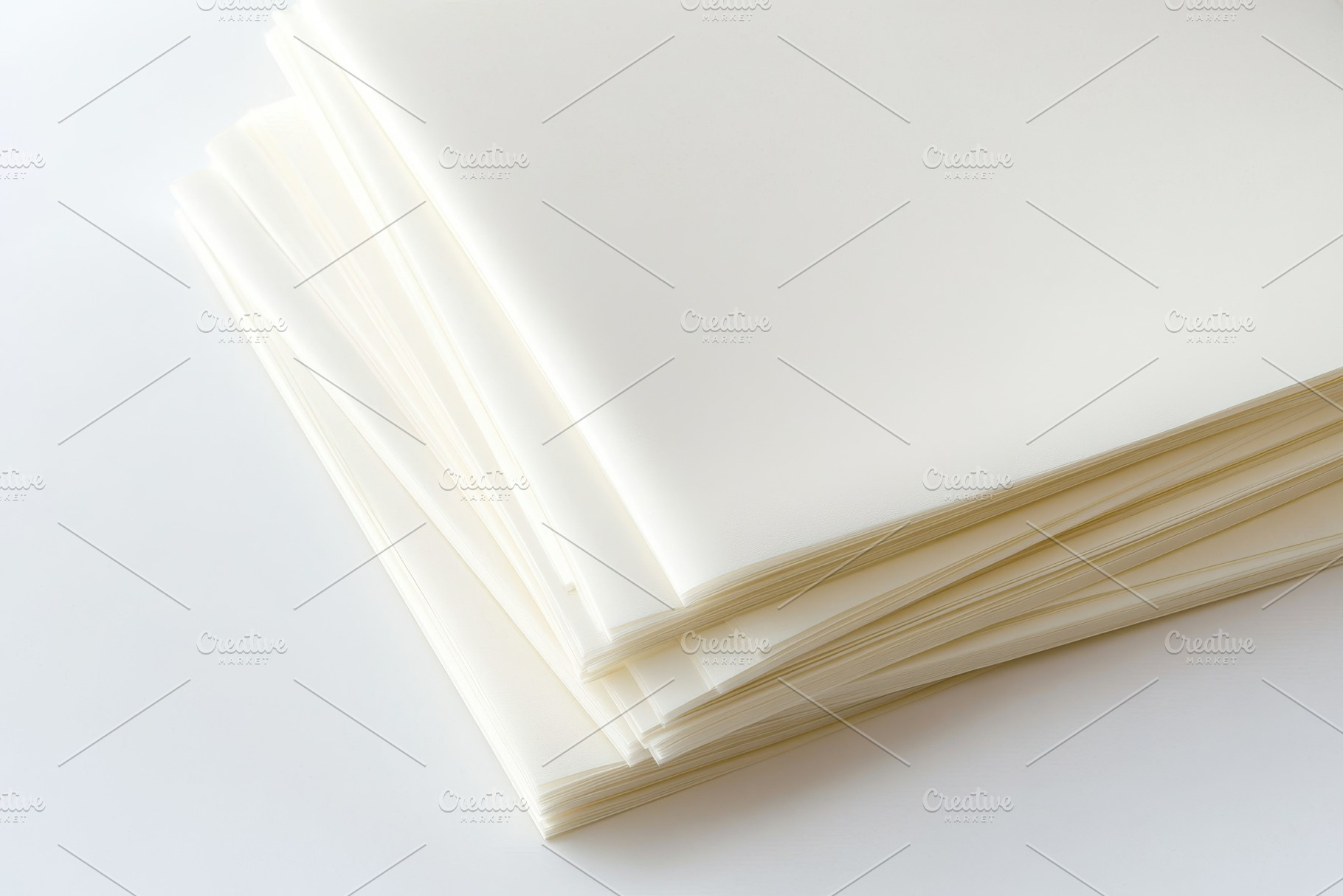 Stack of blank white paper sheets ar, a Background Photo by Pixeness Studio