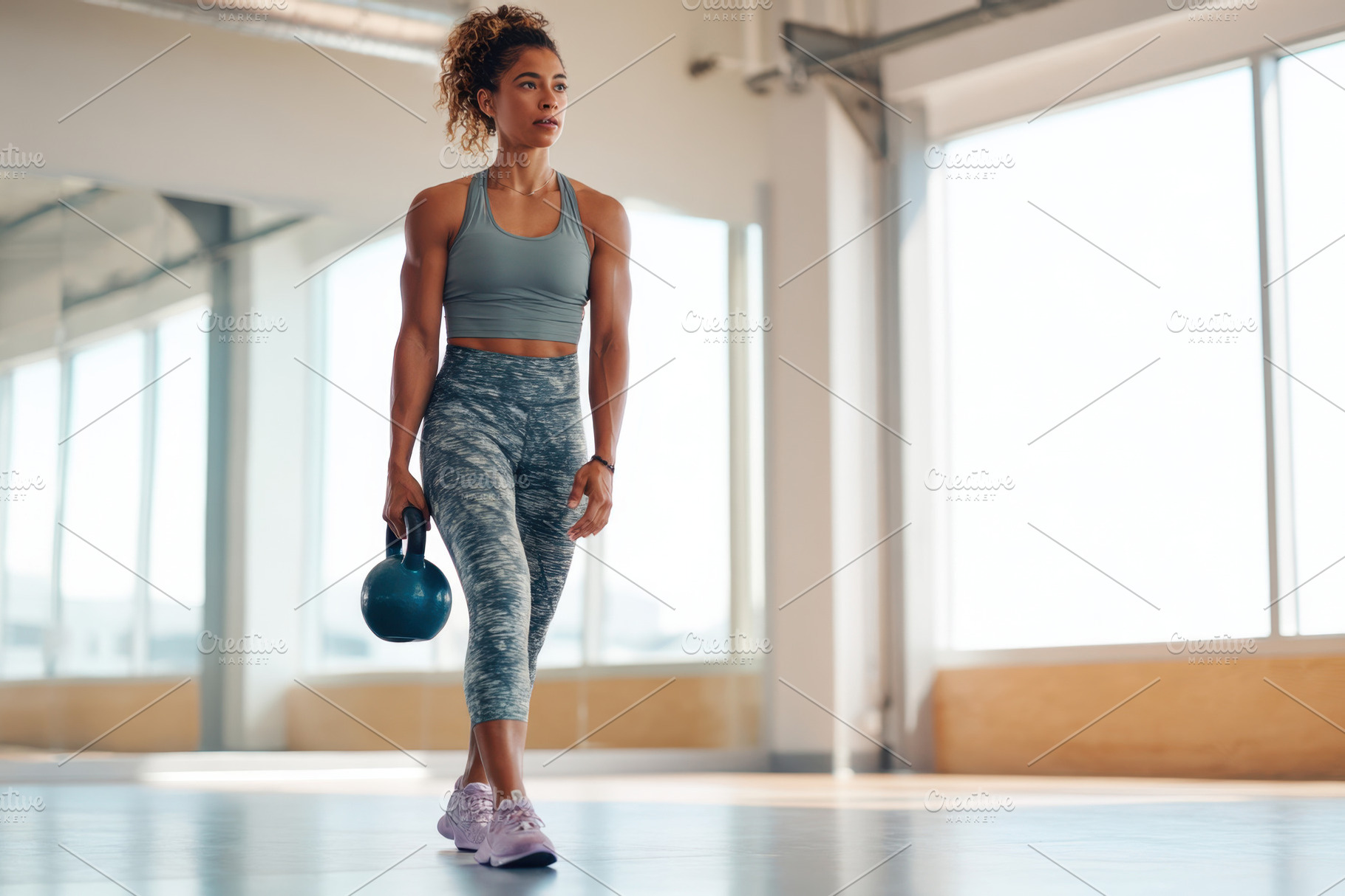 Woman Exercising with Kettlebell in Gym, a Sports & Recreation Photo by AlyaAnd