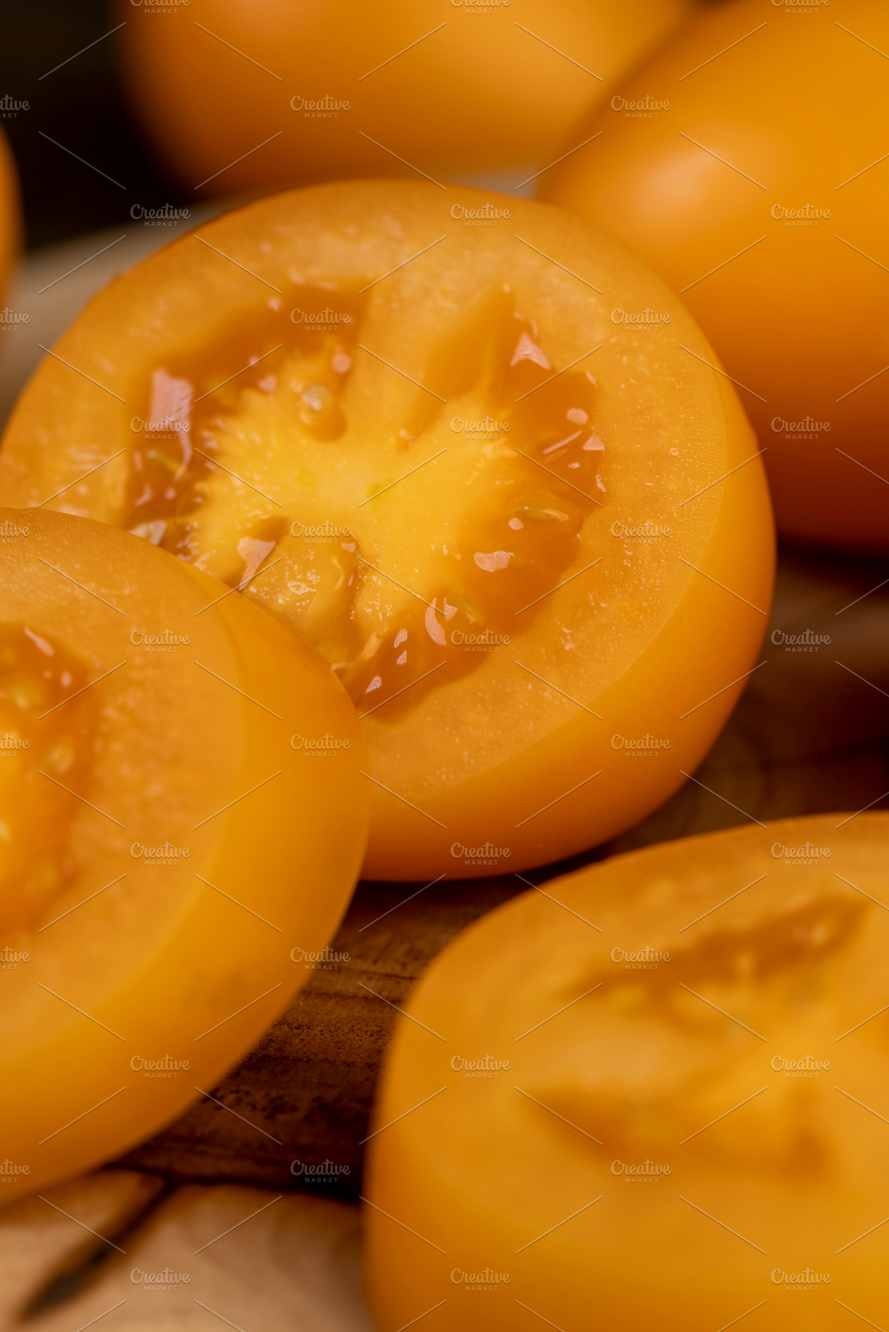 orange tomatoes cut into pieces, clean washed tomatoes are sliced for salad pre, a Photo by rsoollAI