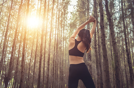 Beautiful slim female runner do stretching arms and warm up to r, a Sports & Recreation Photo by Ministocker