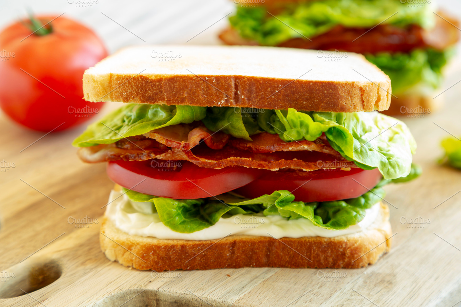 Homemade BLT (Bacon Lettuce Tomato) Sandwich with Mayo, side vie, a Food & Drink Photo by LiudmylaChuhunova