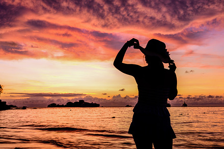 Girl on the beach at sunrise stock photo containing beach and sunrise, a Person Photo by yongkiet jitwattanatam