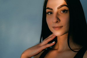 Shiny look face flare pretty light lens woman skin, a Person Photo by Photo Drive Studio